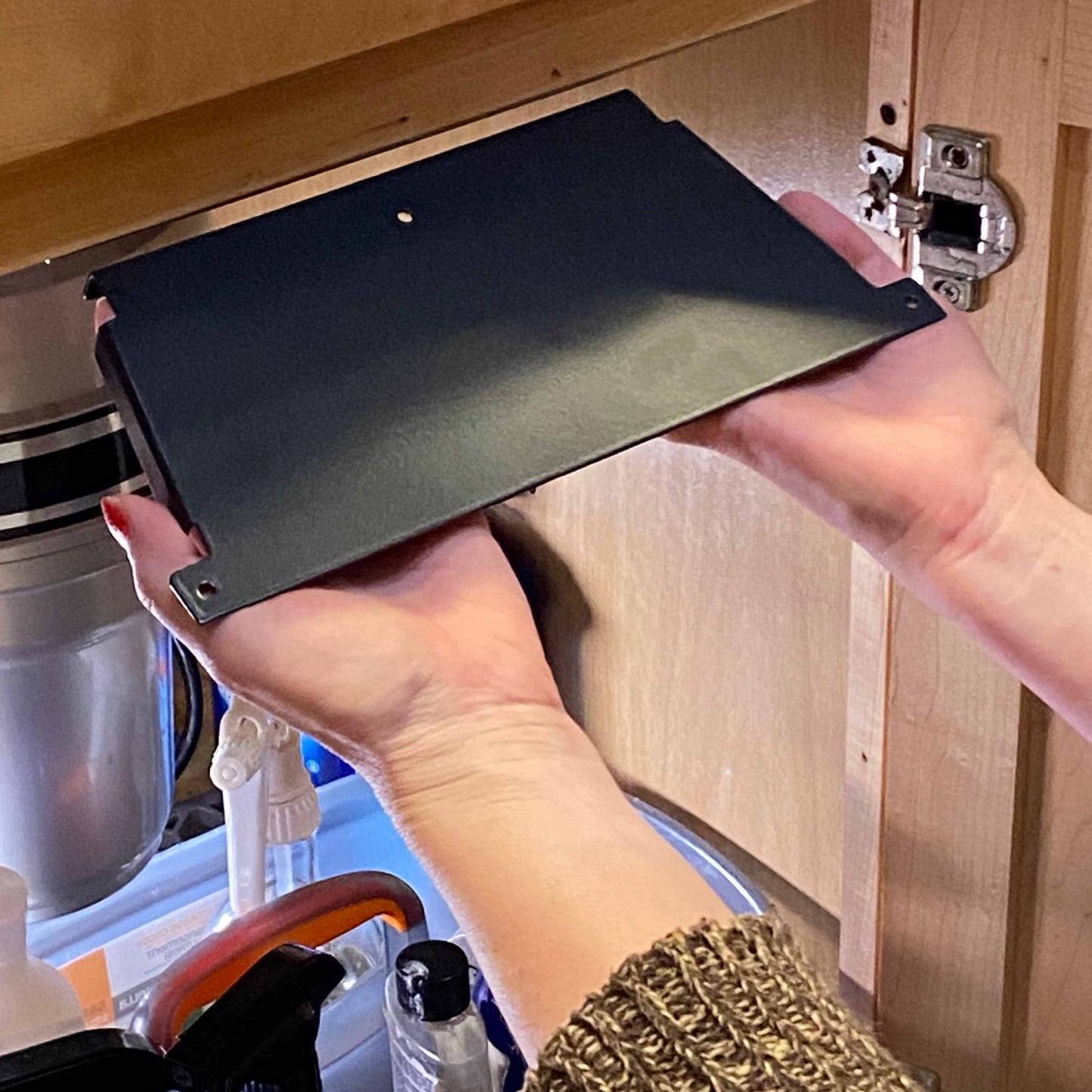 Under Sink/Under Shelf Organizer, Stainless POS mounting plate being installed under cabinet for secure jar attachment and space-saving use.