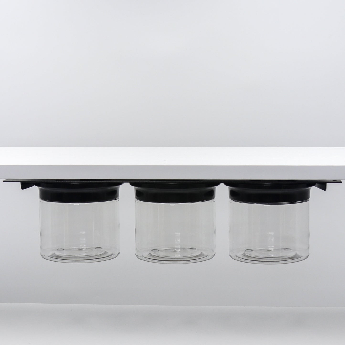 Under Sink/Under Shelf Organizer, Stainless POS with three jars and black lids mounted under shelf, maximizing vertical storage space.