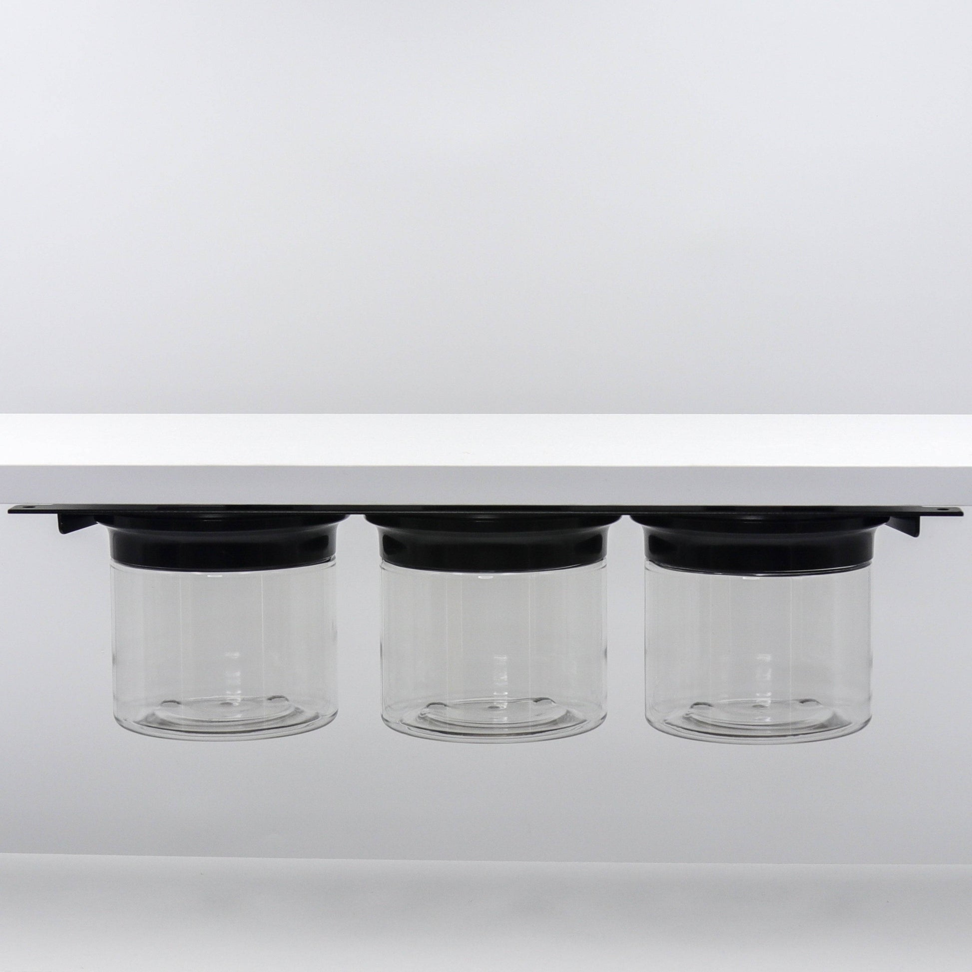 Under Sink/Under Shelf Organizer, Stainless POS with three clear jars mounted under white shelf, ideal for kitchen or bathroom storage.
