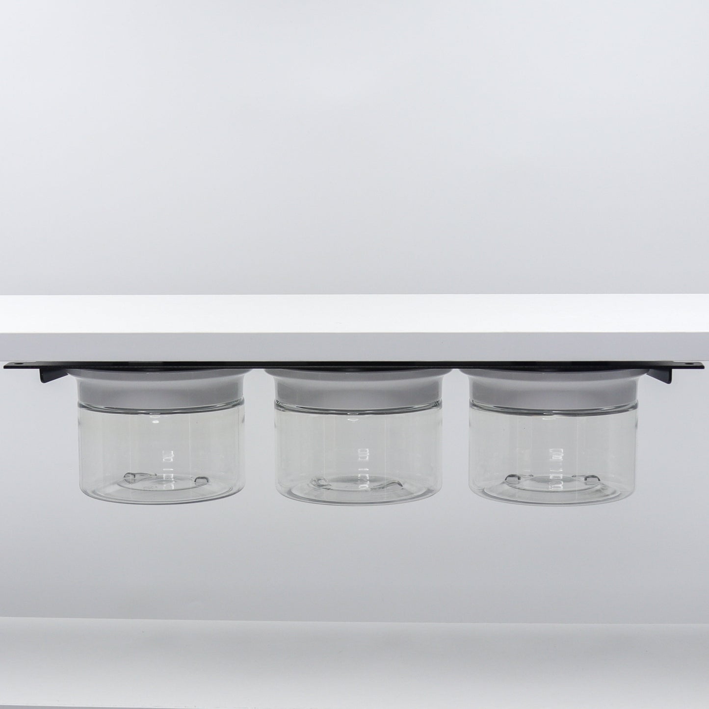 Under Sink/Under Shelf Organizer, Stainless POS with three clear jars and white lids mounted under shelf for organized home storage.