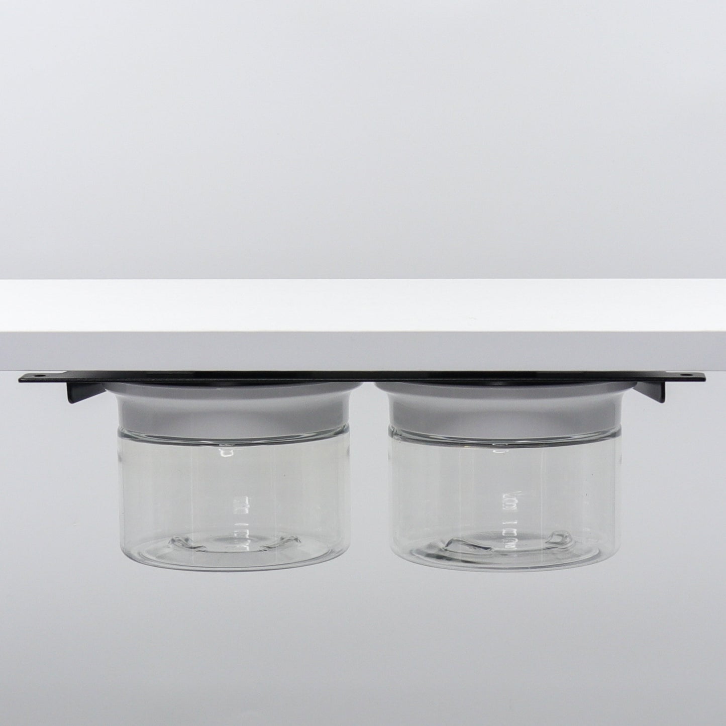 Under Sink/Under Shelf Organizer, Stainless POS with two jars and white lids mounted under shelf, perfect for bathroom or kitchen use.