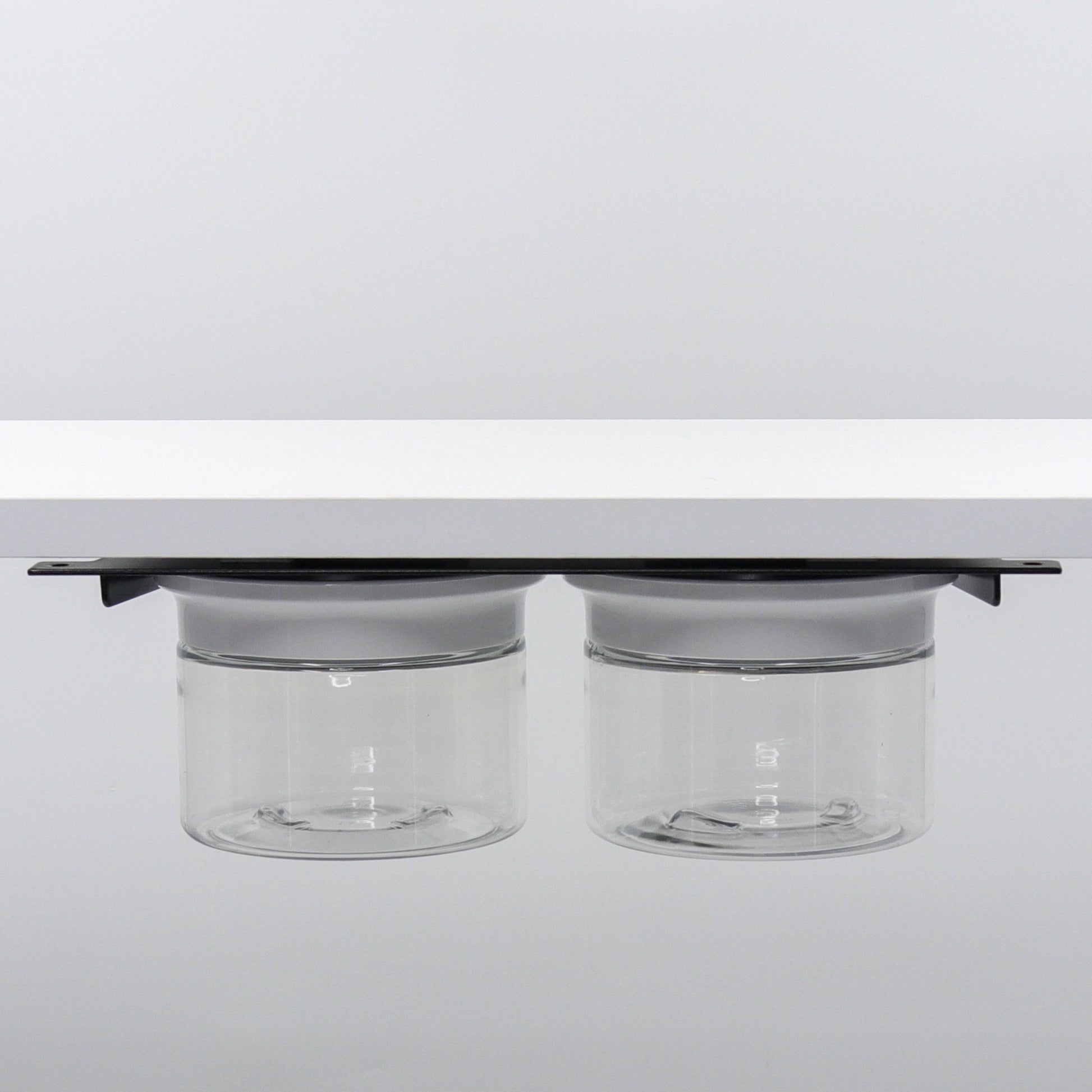 Under Sink/Under Shelf Organizer, Stainless POS with two jars and white lids mounted under shelf, perfect for bathroom or kitchen use.