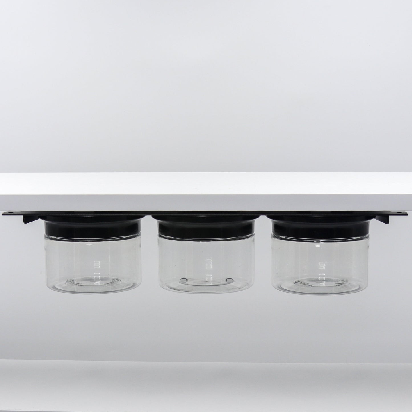 Under Sink/Under Shelf Organizer, Stainless POS with three jars and black lids mounted under shelf, ideal for organizing small items.