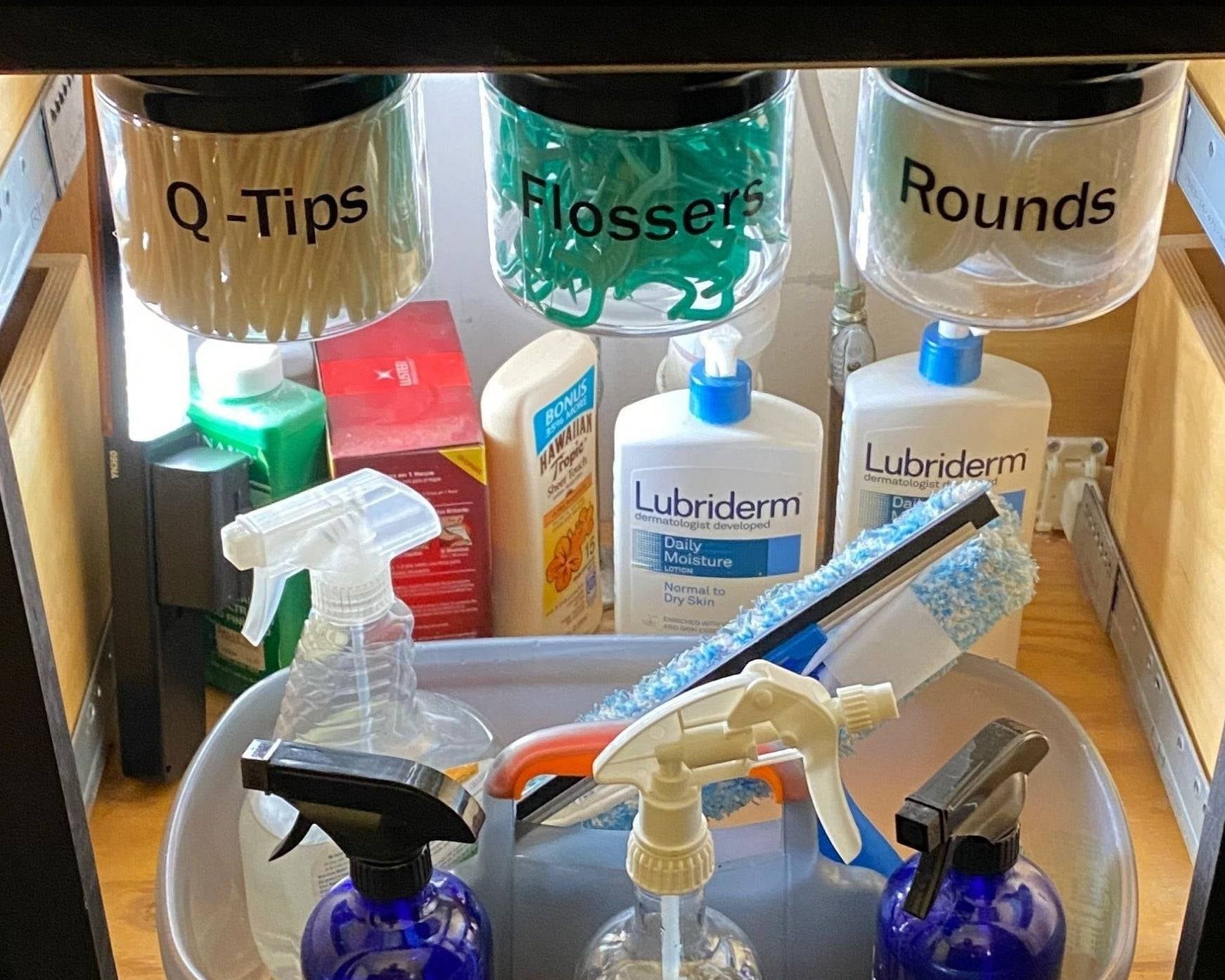 Under Sink/Under Shelf Organizer, Stainless POS jars mounted under sink storing hygiene items, maximizing vertical cabinet space in bathroom.