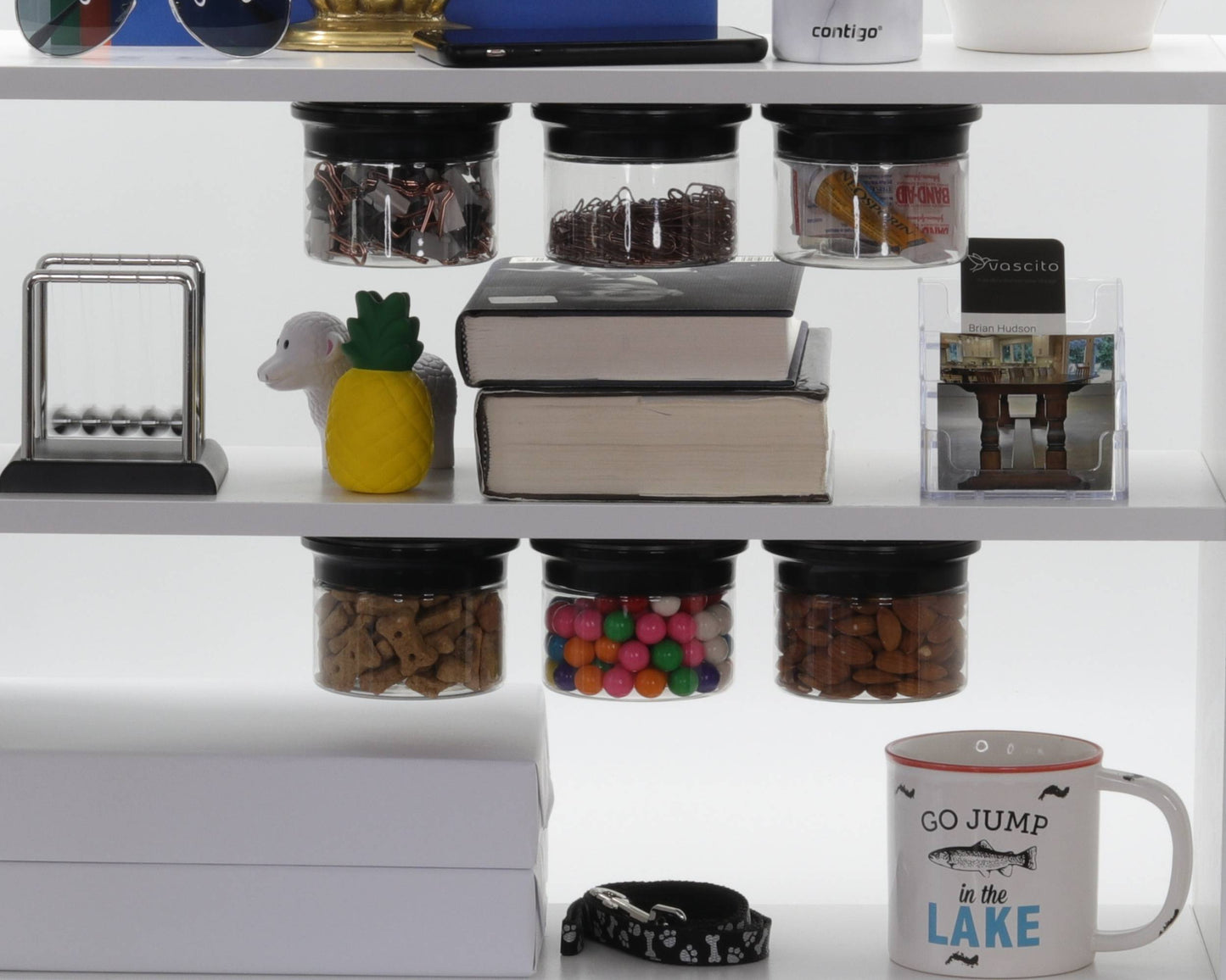 Organized office shelf with multiple Office Stash Jars - Magnetic Jars storing clips, snacks, and candy, maximizing under-shelf space.