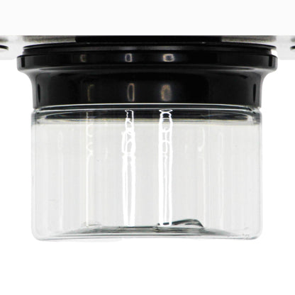 Close-up of empty stash jar with magnetic lid mounted under a cabinet, ideal for space-saving kitchen or office organization.