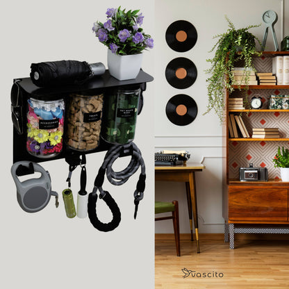 Wall-mounted black dog storage station with jars and hooks displayed in a cozy home interior for easy pet supply access.