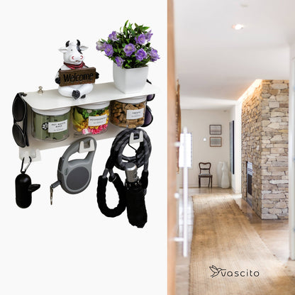 Dog Leash Holder Wall Organizer with treat jars and hooks, styled with a cow figurine and flowers, ideal for hallway pet gear storage.