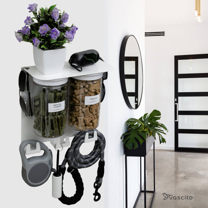 Dog Leash Holder Wall Organizer in white with treat jars, leash hooks, and decor, mounted in a modern hallway for pet supply storage.